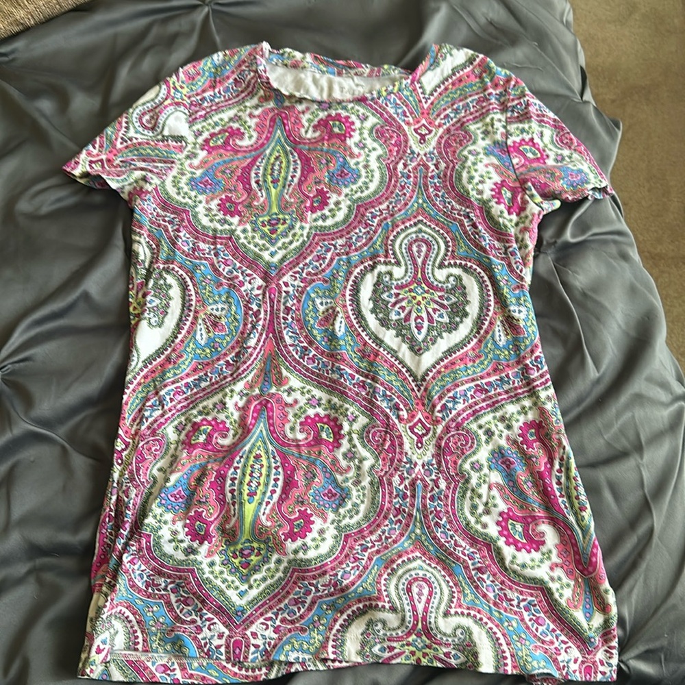 T shirt that can be dressed up or down.  I use to wear with a navy suit.